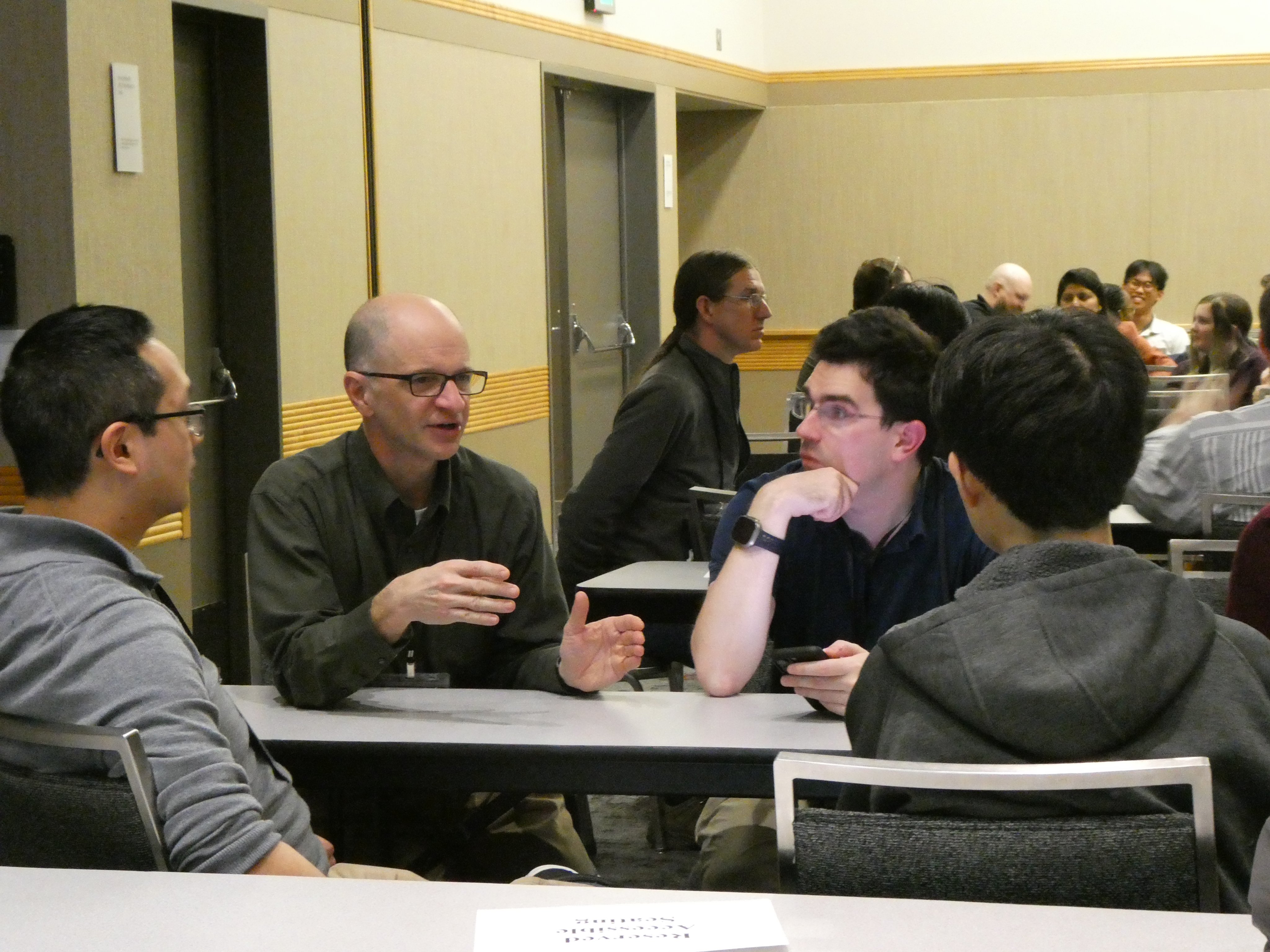 Groups discuss TA programs in 'Birds of a Feather' talk.