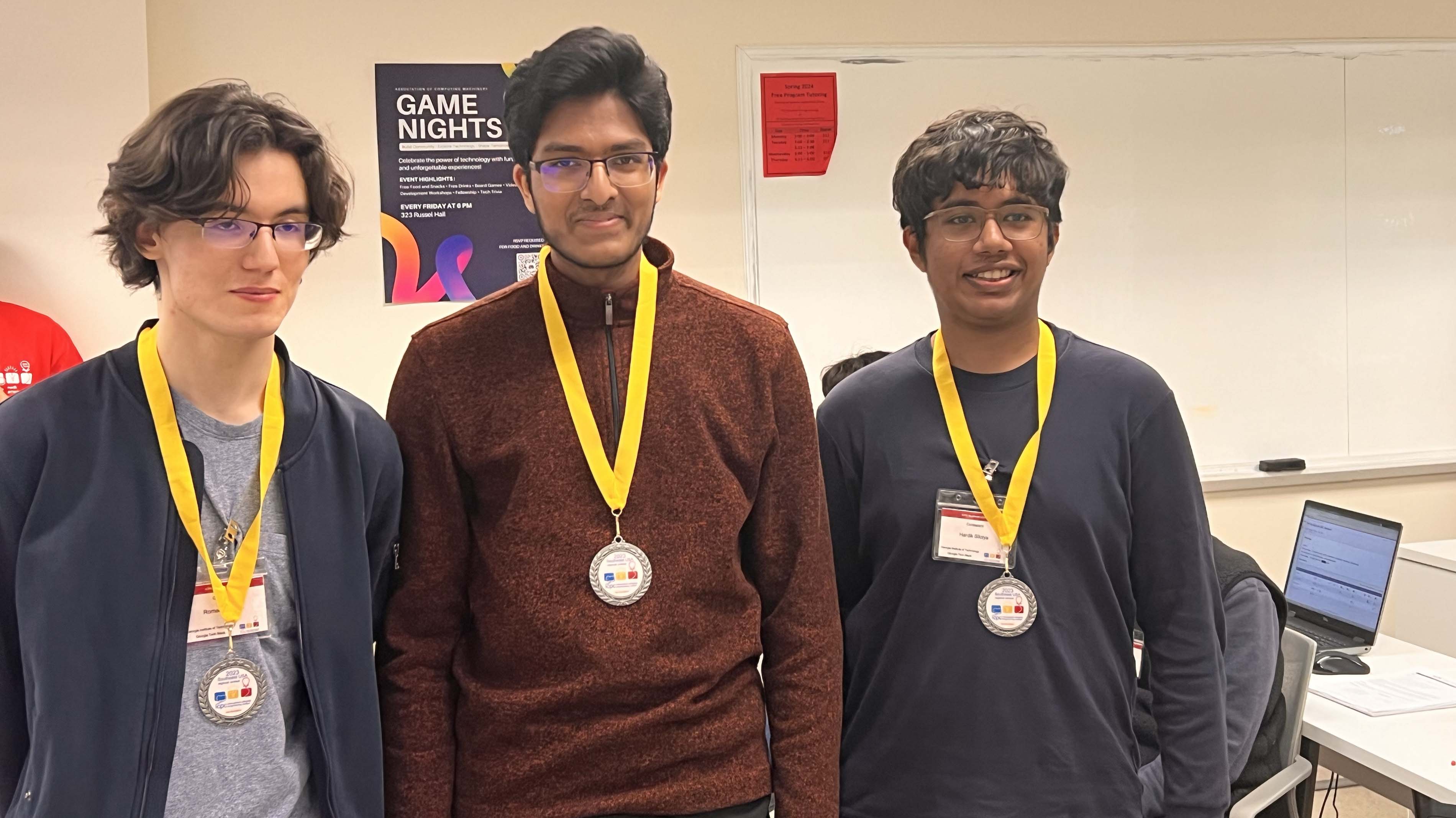Roman Yakunin, Abhinav Govindaraju, and Hardik Siloiya won second place at the competition. Photos by Edward Chen