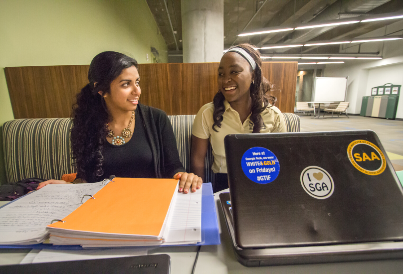 students talking at table