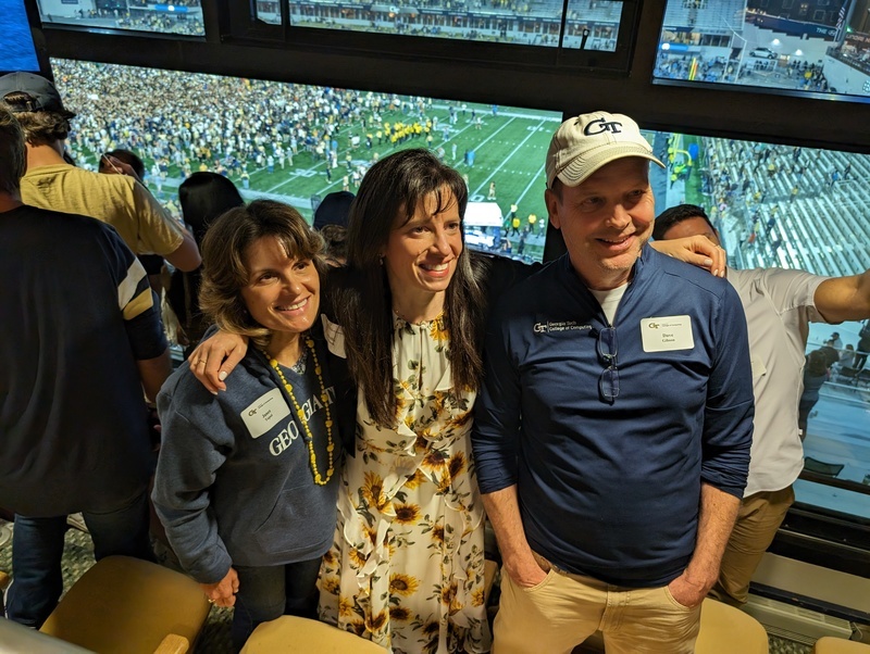 Advisory Board members at a football game