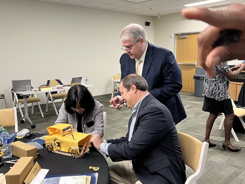 Advisory board group works on a model of the Ramblin' Wreck