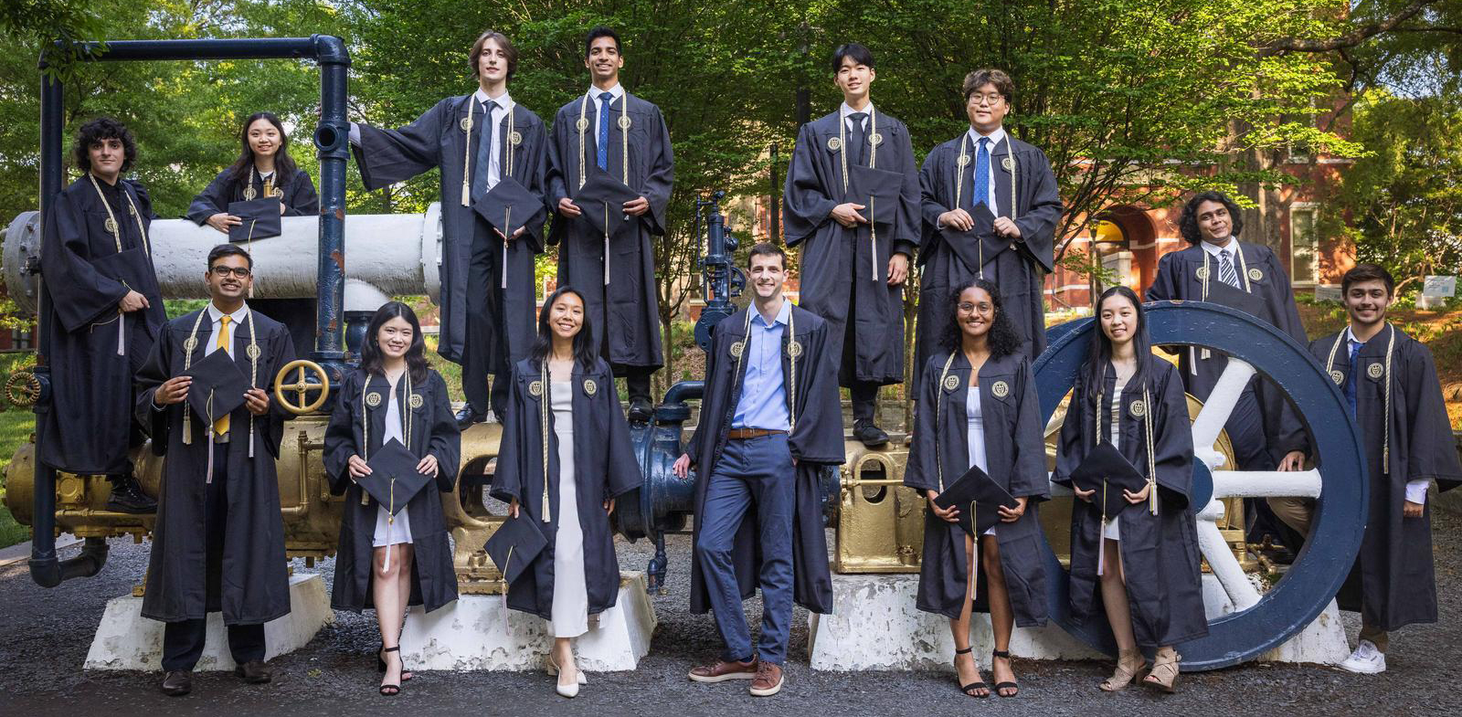 Students standing on the historical steam plant on Cherry St.