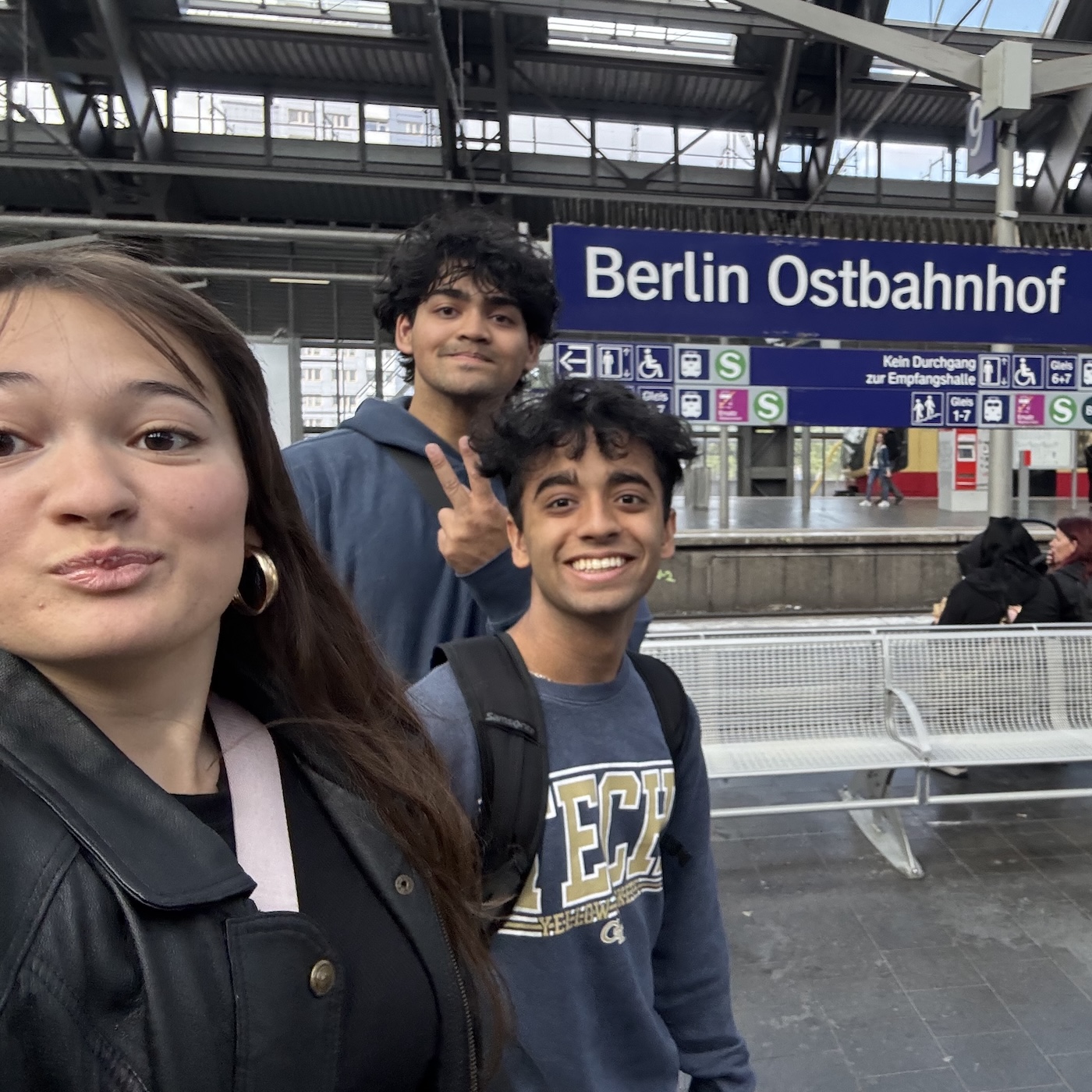 Three students waiting for train
