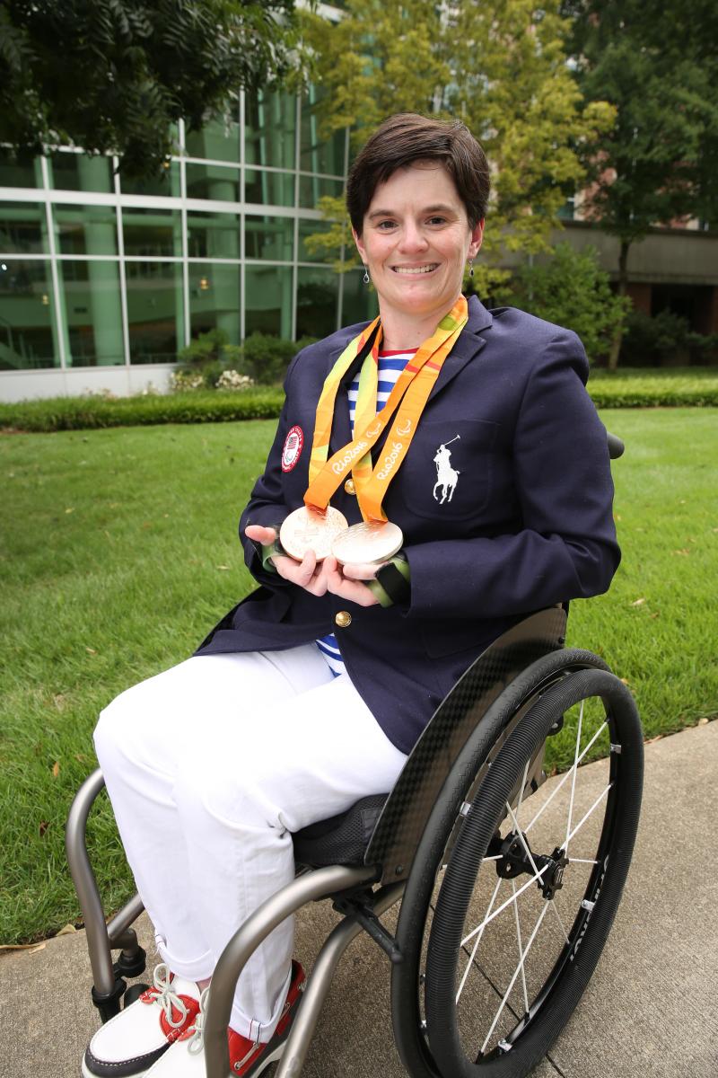 Cassie Mitchell with Olympic medals