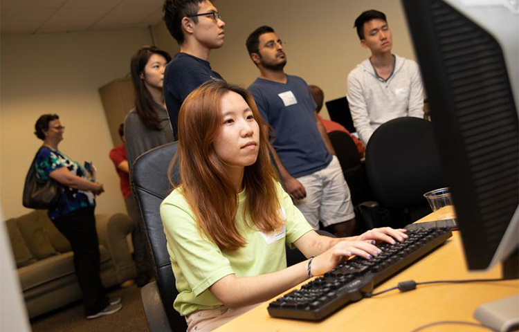 woman sitting at computer