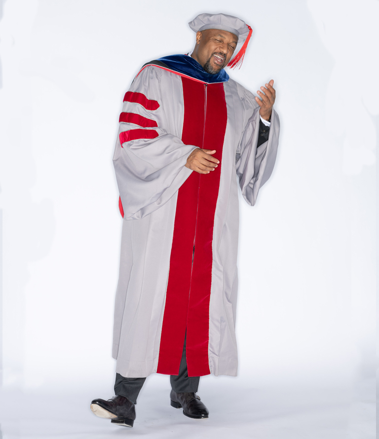 Charles laughing in academic robe