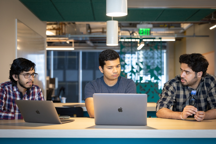 Three students working together