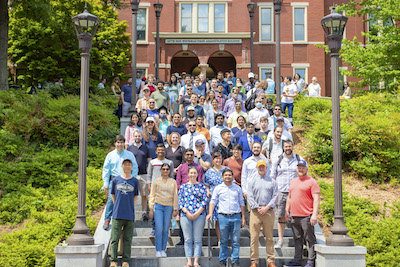 New Georgia Tech OMSCS alumni pose for group photo during a campus tour