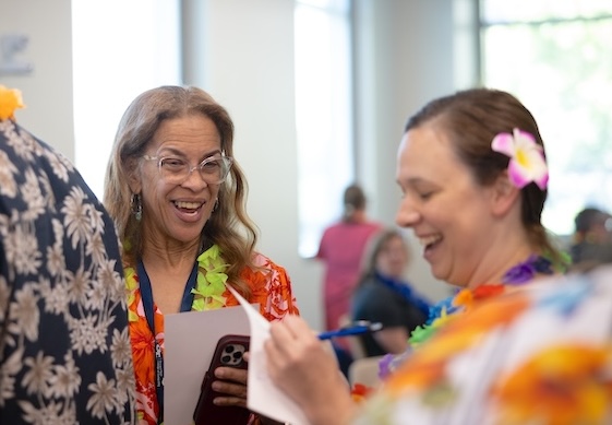Mingle Bingo was one of several highlights of the College of Computing's recent Tropical Celebration for Staff. Photo by Kevin Beasley/College of Computing