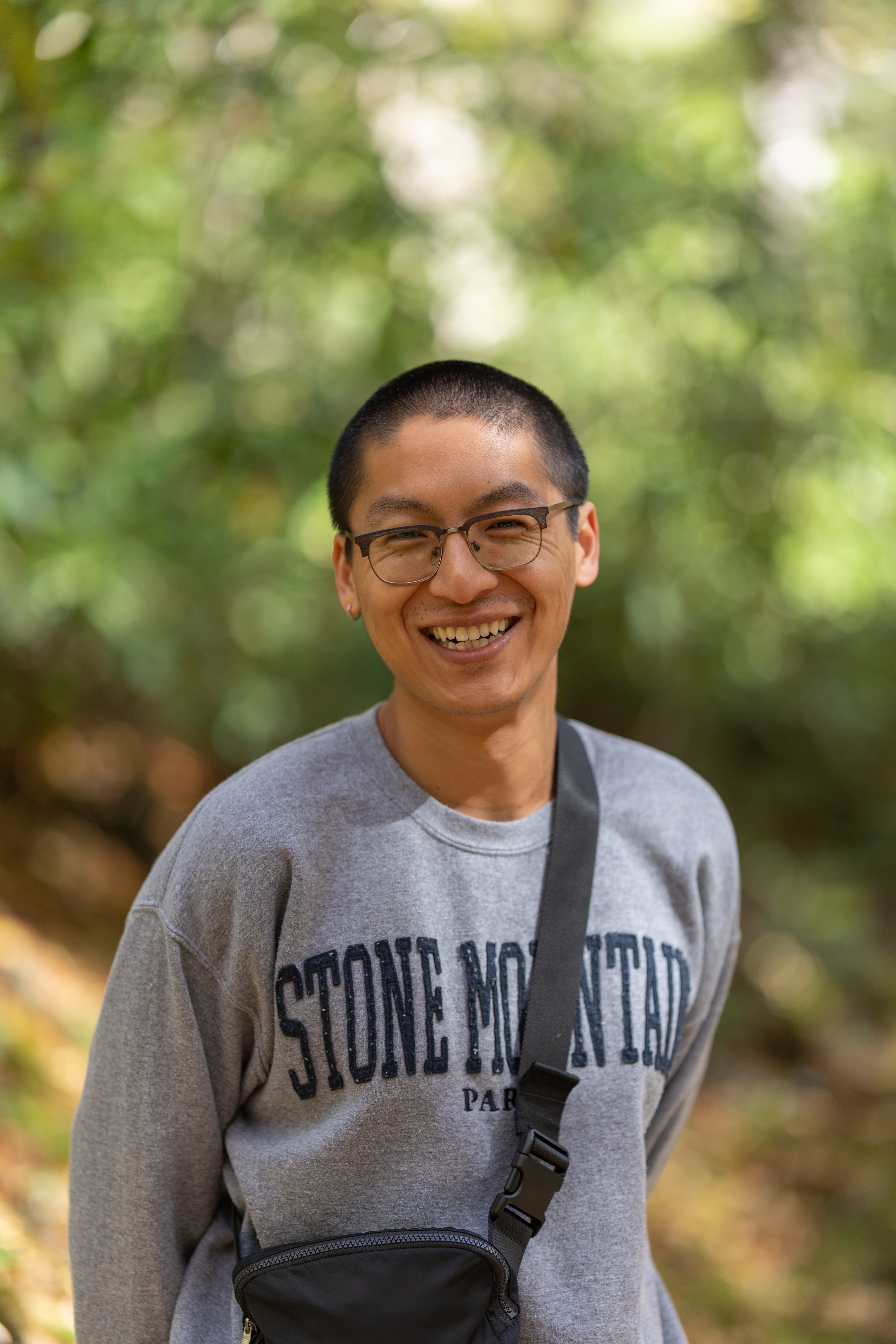A smiling man standing outside 