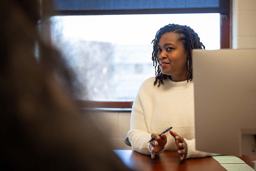 Career Services Advisor Anika McCarty meets with a student.