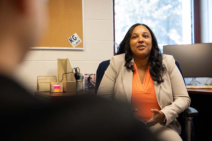 Career Services Advisor Morgan Gore assists a student in her office.