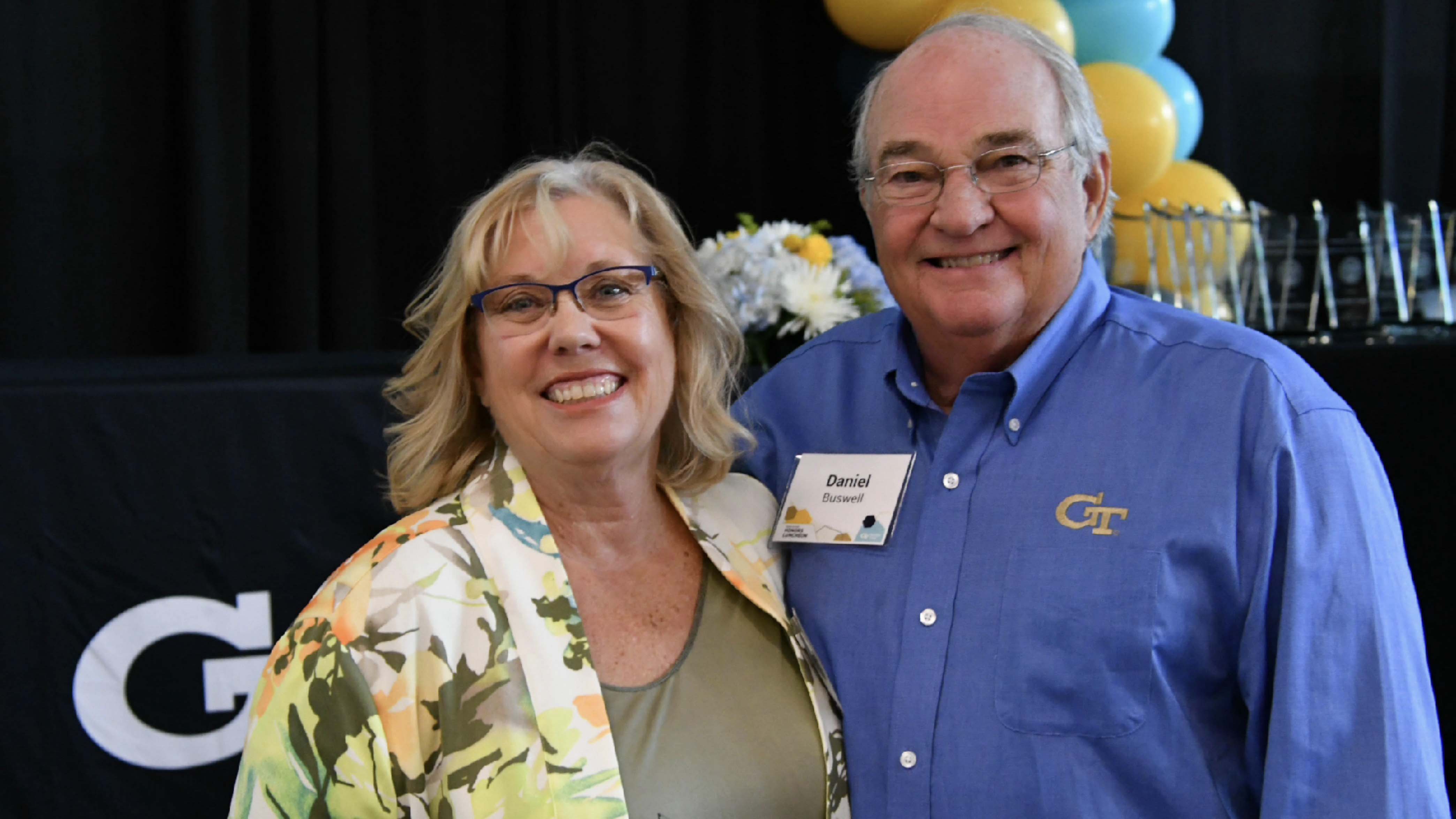 Mary celebrates at the awards ceremony with her husband Daniel Buswell.