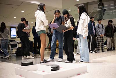 Borela's students use robots in class to learn coding. Photos by Kevin Beasley/ College of Computing.
