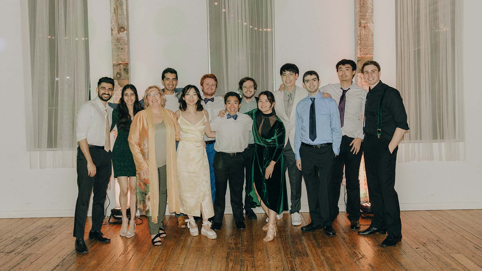 Lecturer Mary Hudachek-Buswell and alumni attend the wedding.