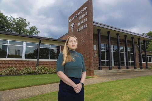 woman standing in front of building