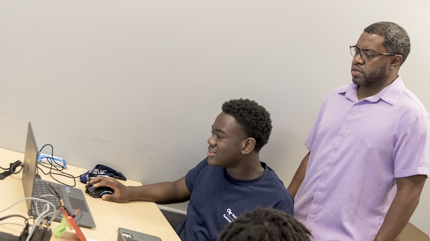 GT Computing's Terry Foster (right) helped to develop the College's expanded offering for the 2026 Georgia Tech Summer Institute.