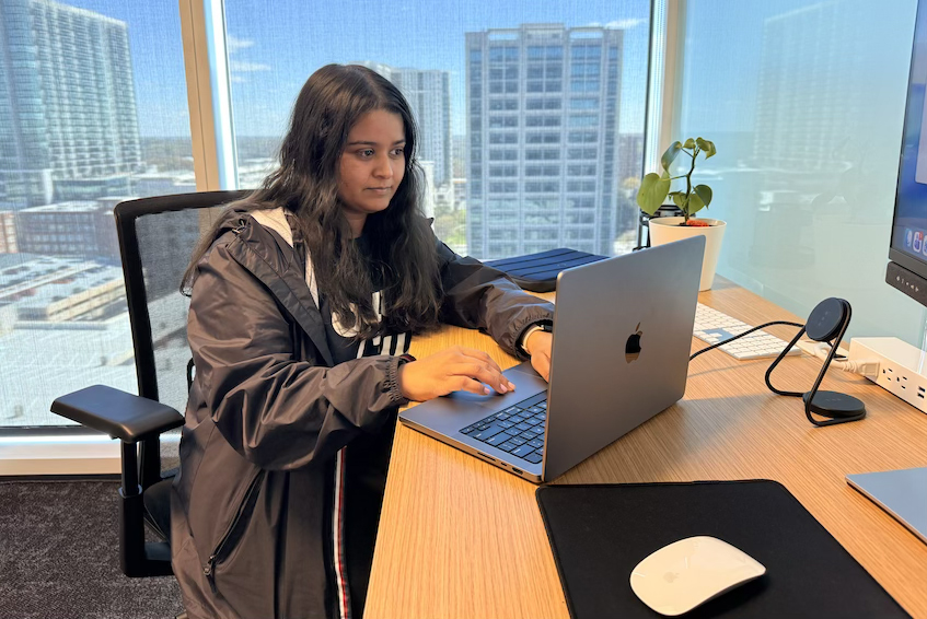 Niharika Mathur works on her laptop at her desk