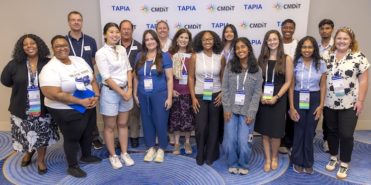 GT Computing contingent poses for a group photo at Tapia 2026.