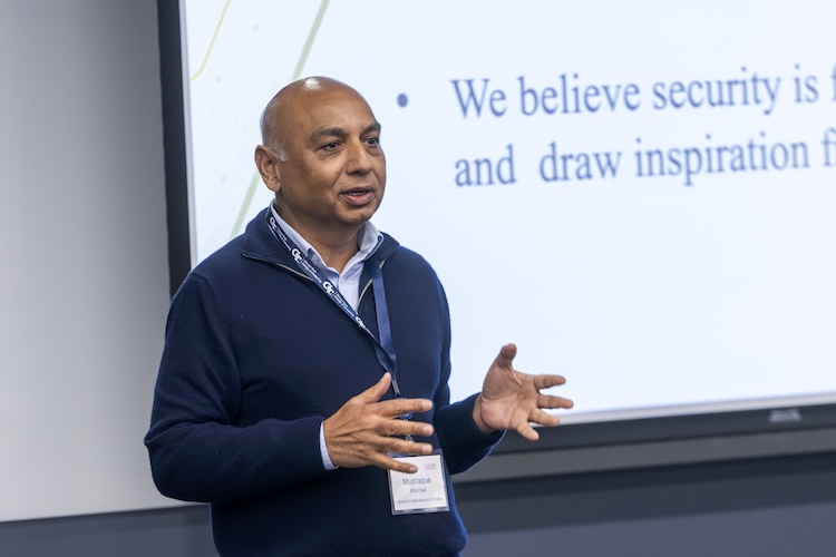 Speaking  during a presentation is Mustaque Ahamed is the Georgia Tech School of Cybersecurity and Privacy Interim Chair, USG Regents Entrepreneur Professor