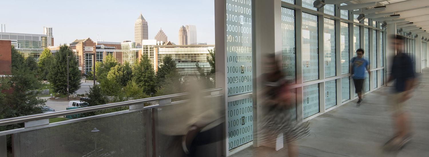 Students on the Binary Bridge with a view of Atlanta