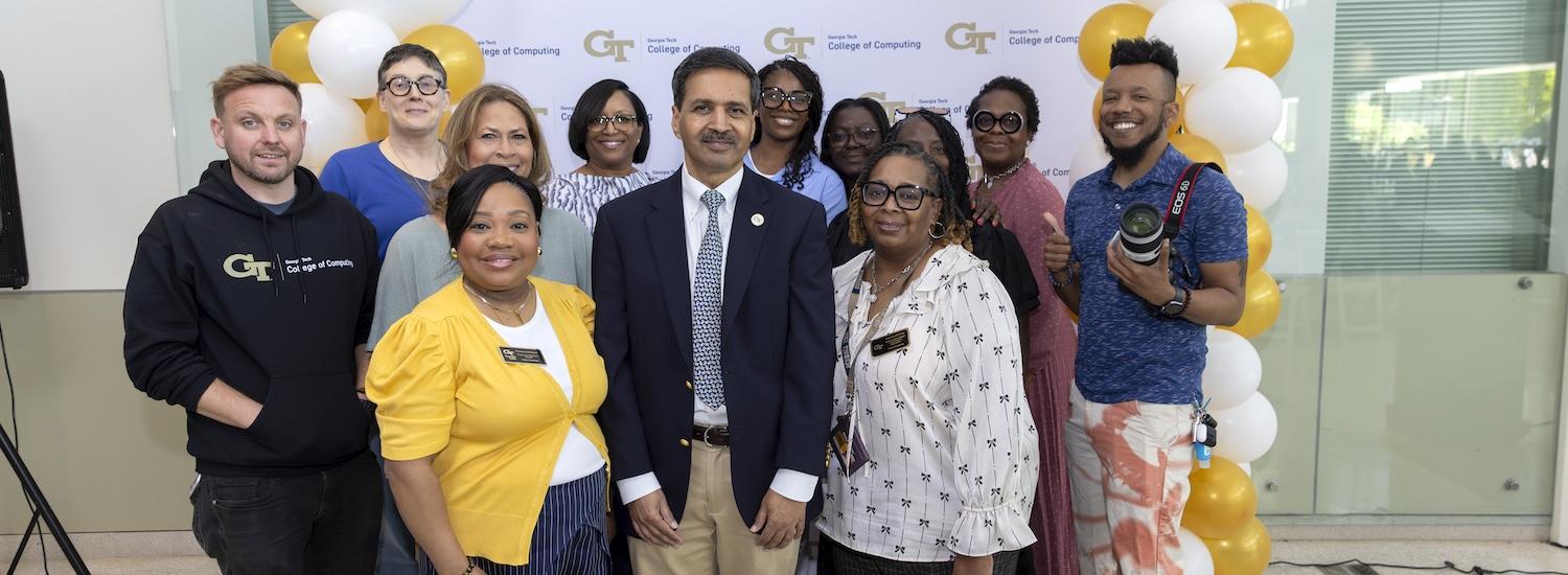 Georgia Tech Dean of Computing Vivek Sarkar flanked by college staff mebers during an event in 2026