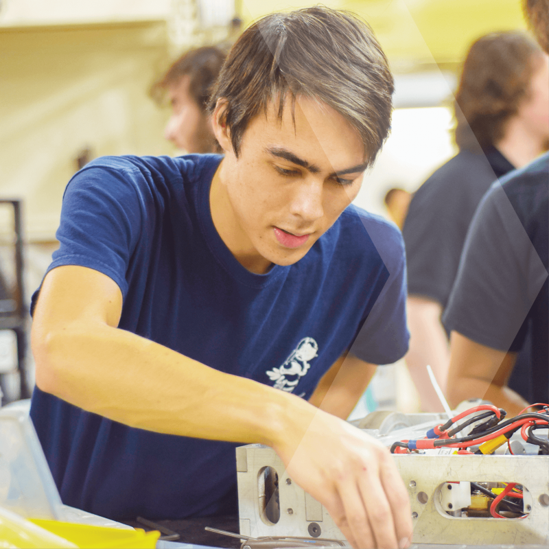 Student working on electrical and wiring equipment