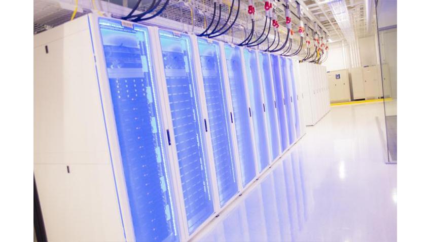 A row of servers with blue LED lights