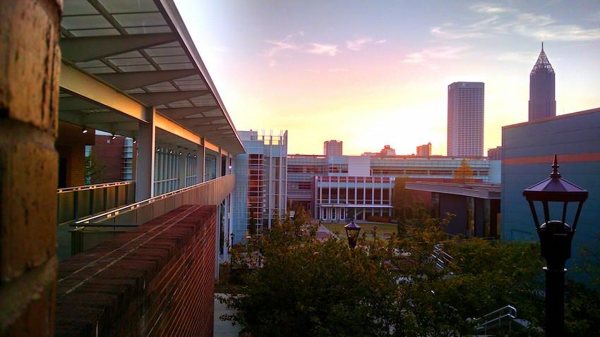 The midtown Atlanta skyline at dawn as seen from the Georgia Tech College of Computing's Binary Bridge