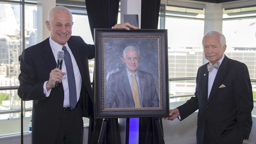 Former Georgia Tech deans of computing Zvi Galil and Peter Freeman unveiling a framed portrait of Galil