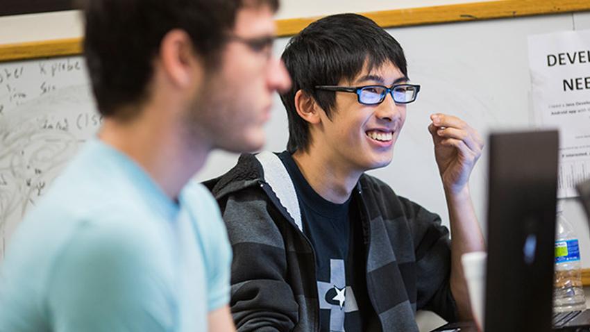 man smiling in classroom