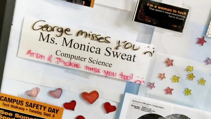 A close up photo of Monica Sweat's office door at the Georgia Tech College of Computing. The door has stars and stickers and her name
