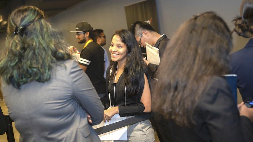 a young woman smiling during a Georgia Tech career fair