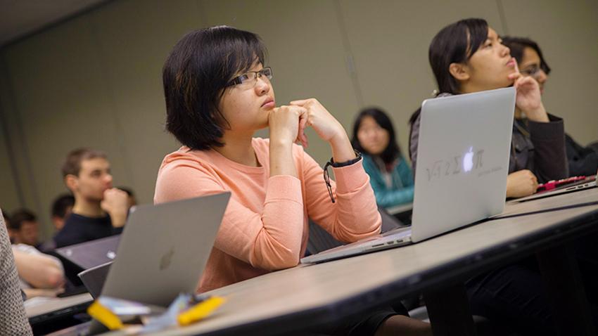 woman at desk in class