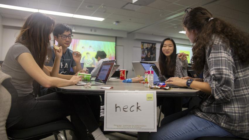 students working together as a team at a table