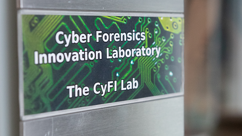 Sign with text: Cyber Forensics Innovation Laboratory. The CyFI Lab
