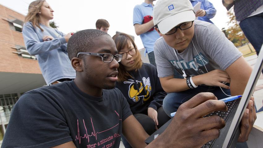 Small group of Georgia Tech Computer Science Majors working together on a project