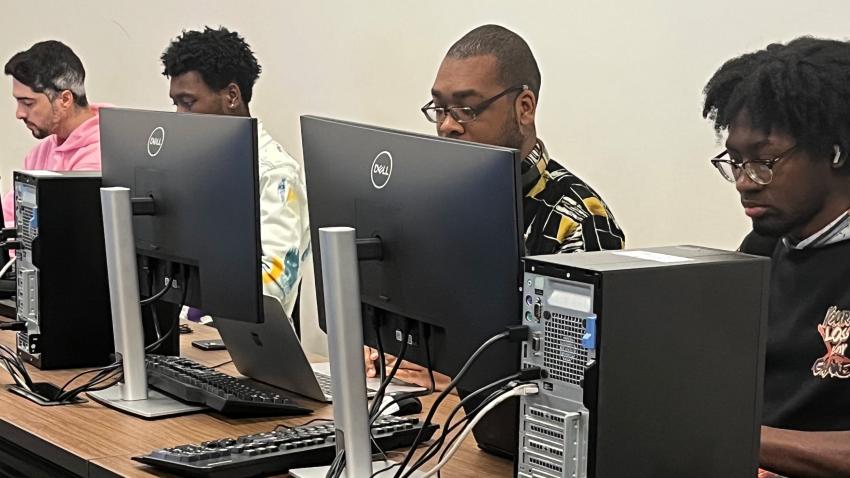 4 young men focusing on an Earsketch training