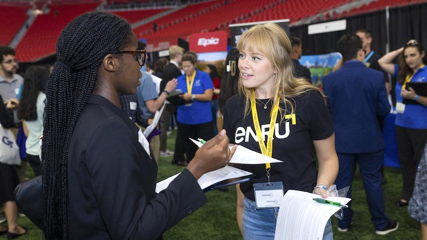 Company Rep talks with student at GT Computing 2023 Fall Career Fair