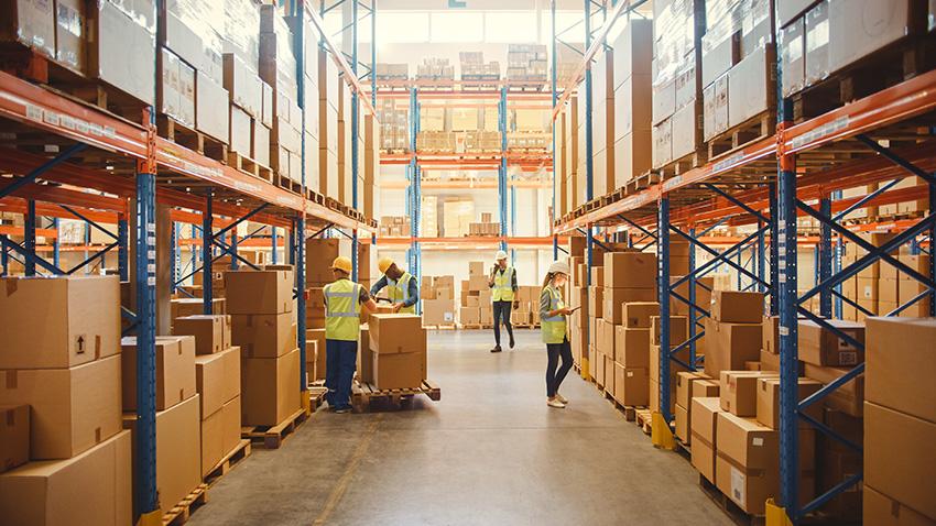 Ground floor shipping experts working inside a warehouse