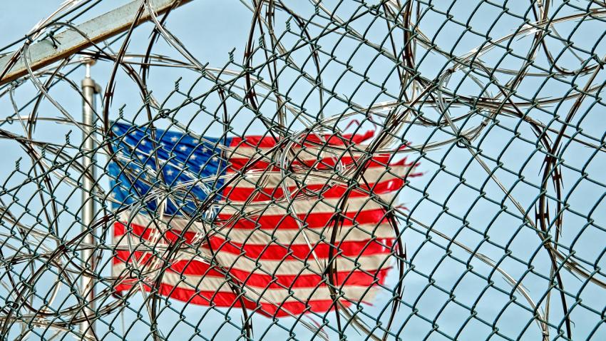 Flag behind a fence