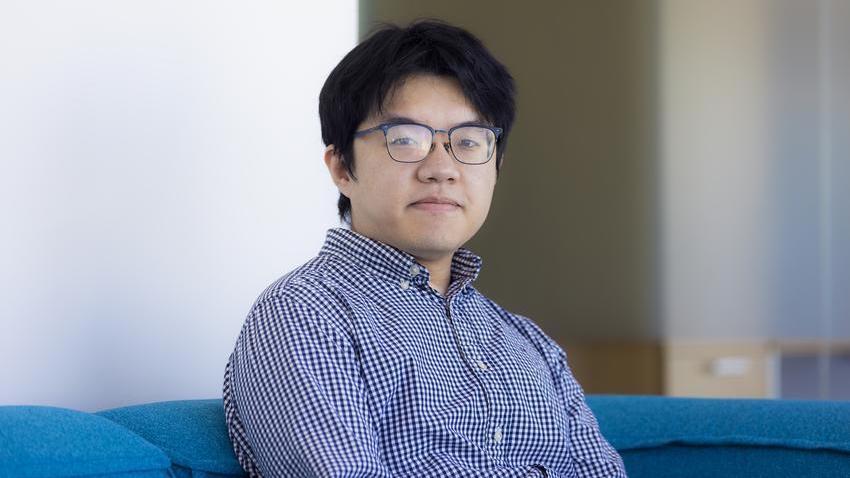 A man sitting on couch.