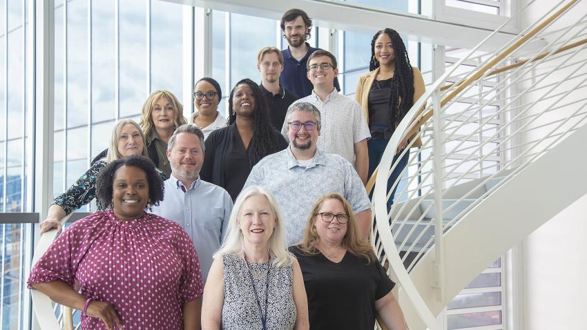 a group of people standing on the stairs