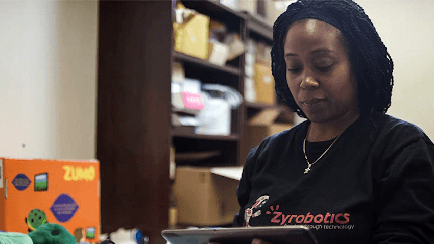 Ayanna Howard looks at her tablet while working with Zyrobotics