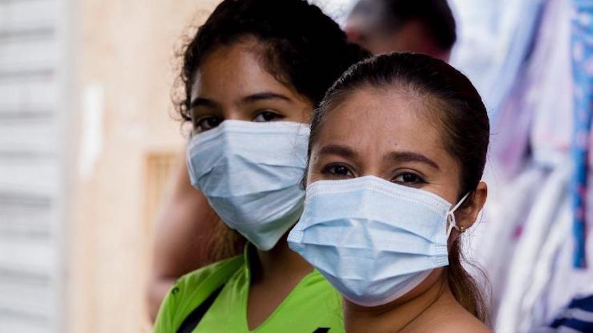 Two women wear masks during the Covid-19 pandemic