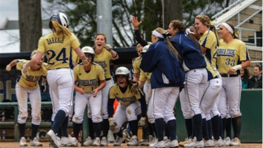 The Georgia Tech softball team celebrates at home plate.