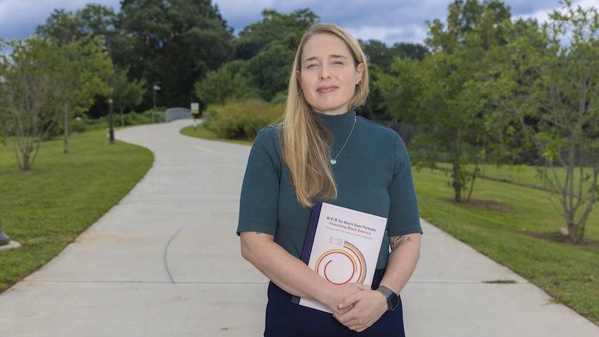 Woman standing on walking path