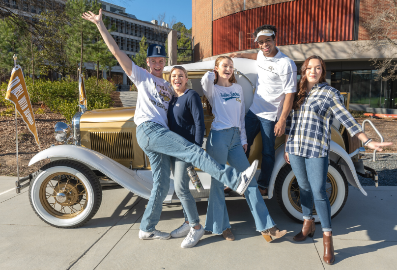students in front of Ramblin' Wreck