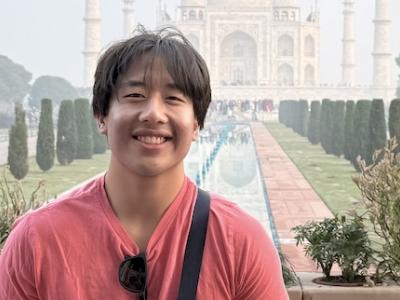 Graduating CS Major Andrew Wang outside the Taj Mahal