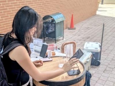 A student enters her selection with VinoBarrel, which serves juice and flavored tea during all-ages product demos.
